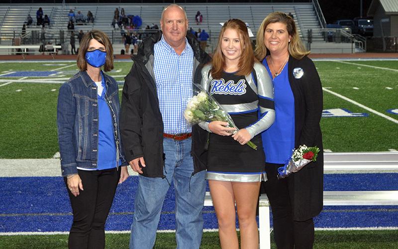 Catherine Finley was one of six cheerleading seniors that was honored at Fannin County senior night Friday, October 9. Finley is shown with her parents Philip and Heather Finley.