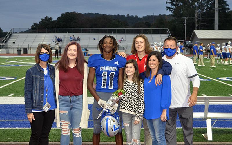 Andre Bivens was one of 15 seniors honored before the Rebels football game against Gordon Central Friday, October 9. Shown are, from left, Ivy Hyde, Bivens, Danica Padrut, Chaz Padrut, Joci Padrut and coach Chad Cheatham.