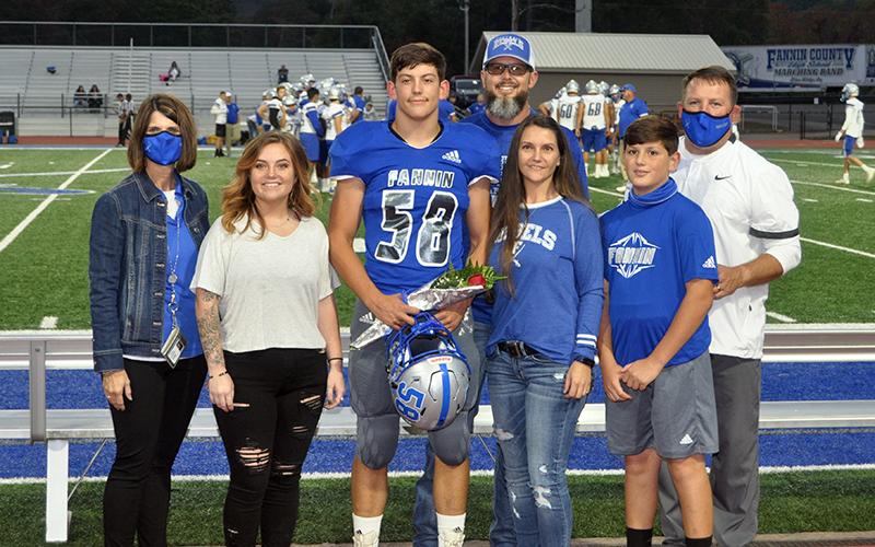 Fannin County High School honored the senior football, cheerleaders, band, cross county and sports medicine members before the Rebels game with Gordon Central Friday, October 9. Shown are, from left, sister, Chelsea Quintrell, senior, Bradyen Foster, father, Micah Foster, mother, Charlene Foster, brother, Vince Foster and coach Chad Cheatham.