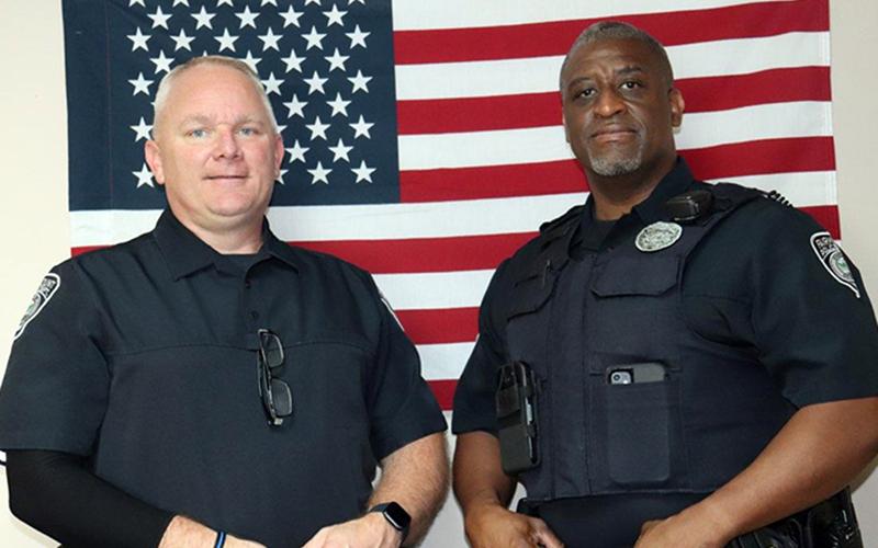 Fairmount Police Department Detective Billy Brackett, left, and Officer Mike Taylor were honored during a meeting of the city's council for turning a bad situation around and saving a life.