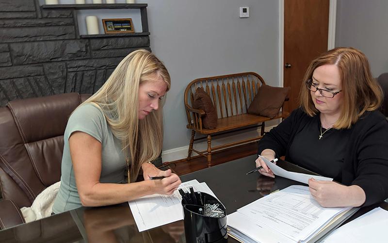 Habitat for Humanity of Fannin and Gilmer counties’ most recent home build recipient Kristen Haley, left, officially became a homeowner Saturday, September 30. She is shown beside Attorney Laura J. Ray.