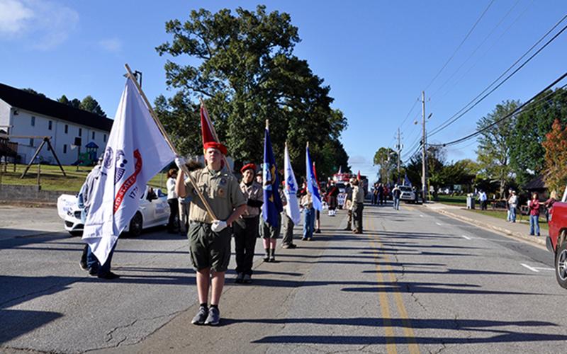 Local Boy Scouts of America, led by Ethan Jolly, led the Mountain Patriots’ “God &amp; Country” parade and rally through downtown Blue Ridge.