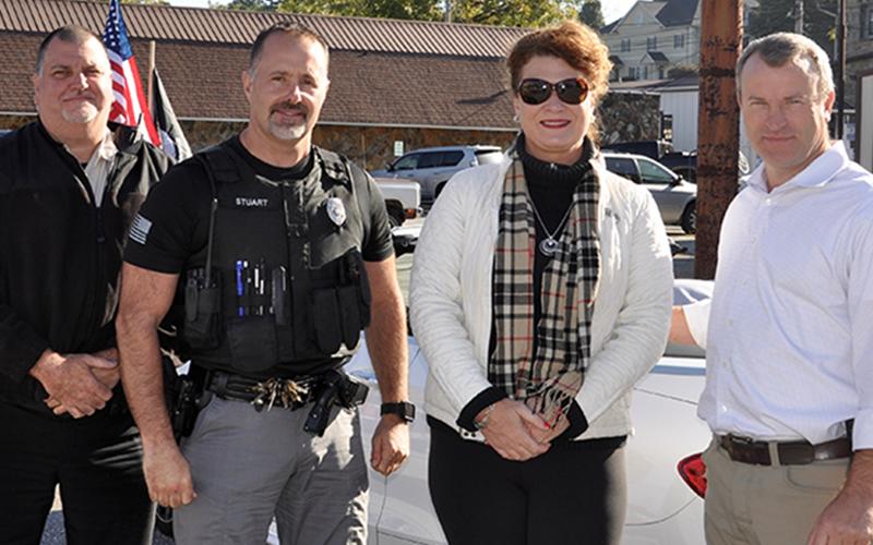 RIGHT: Fannin County District Attorney Alison Sosebee acted as the master of ceremonies during the Mountain Patriots’ parade and rally for “God &amp; Country” in downtown Blue Ridge Saturday, October 3. Sosebee is shown with, from left, Fannin County Sheriff’s Deputy John Bramlett, Blue Ridge Police Department Captain Robbie Stuart and Sheriff Dane Kirby.