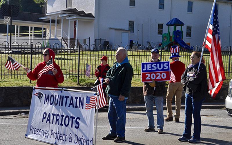 The Mountain Patriots held a “God &amp; Country” parade and rally in downtown Blue Ridge Saturday, October 3. There to march are, from left, Candy Zacher, Roger Washbelesky, Larry West and Jackie Sheerer.