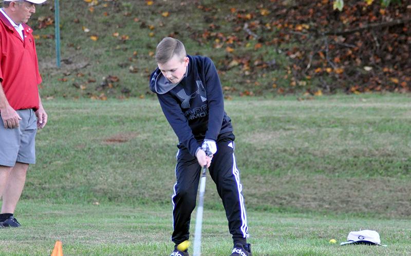 Logan Long works on his chipping game at golf practice hosted by the Fannin County Recreation Department Tuesday, October 13.