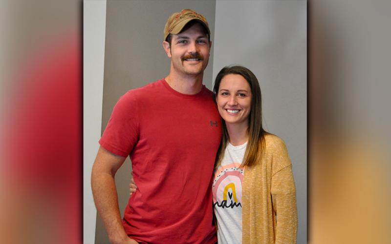 Justin and Samantha Petty are shown waiting in line to early vote at the Fannin County Courthouse Monday, October 19.