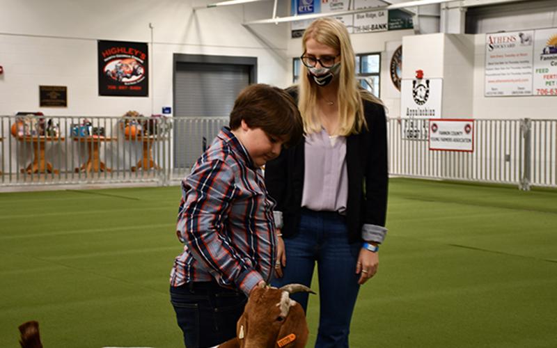 Fannin County Youth Fair judge Emily Cantrell discusses Jake Ware’s competition performance with him during the 2020 Youth Fair Saturday, September 28.