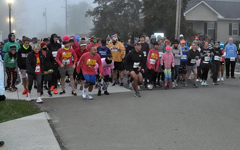 Runners take off at the start of the Bigfoot Boogie 5K Saturday, October 31. The 5K went through McCaysville and Copperhill, before ending in McCaysville City Park.