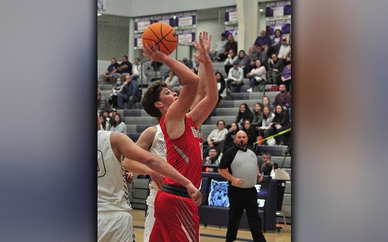 Cougar Timothy Jabaley fights through contact for a two-point basket during the Cougars matchup against Gilmer County Saturday, November 21.