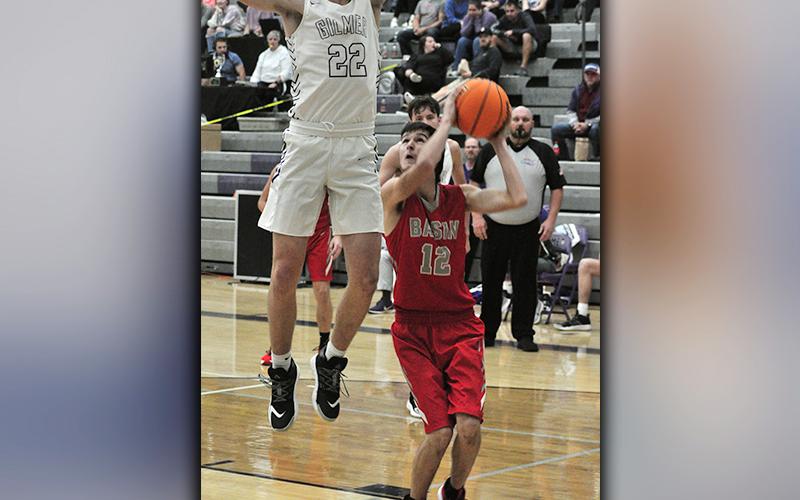 Copper Basin Cougar Austin Collis draws a defender on a pump-fake during the Cougars game against Gilmer County Saturday, November 21.