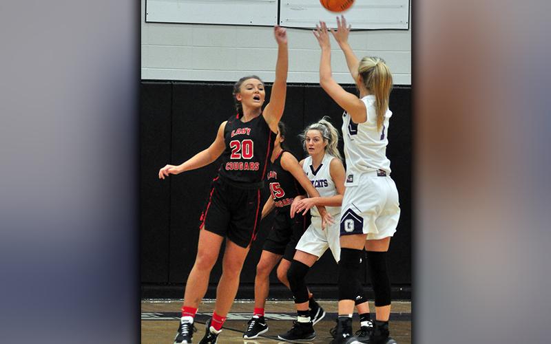 Lady Cougar Sapporiah Ross goes up to contest a jumpshot during Copper Basin’s game against Gilmer County Saturday, November 21.