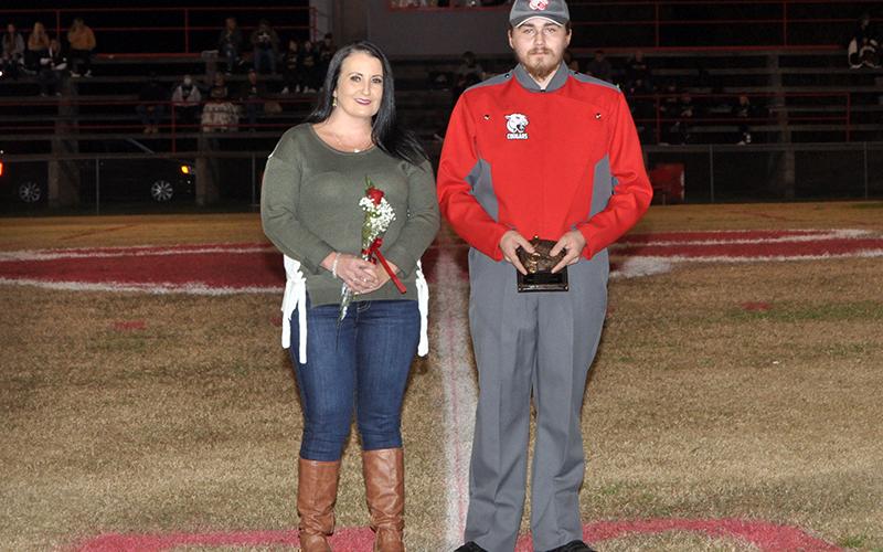 Copper Basin High School honored their golf, band, cheerleaders and football seniors Friday, November 6, at the Cougars home playoff game against Clay County. Senior band member Zeke Brendle is shown with Dena Crawford Brendle.