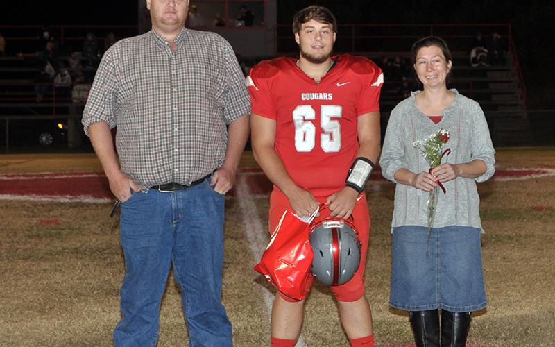 Copper Basin honored its football seniors Friday, November 6, before their last home game against Clay County. Senior football player Joseph Johnson is shown with his parents Daniel and Jennifer Johnson.