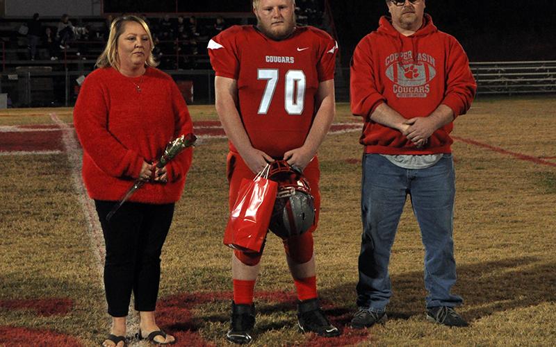 Copper Basin honored its football seniors Friday, November 6, before their last home game against Clay County. Senior football player Blake Picklesimer is shown with his parents, Amanda Gray and Tim Picklesimer.