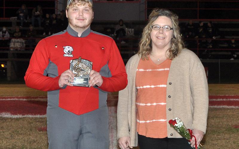 Copper Basin High School honored their golf, band, cheerleaders and football seniors Friday, November 6, at the Cougars home playoff game against Clay County. Band senior Adam Ferguson is shown escorted by Alison Arp.