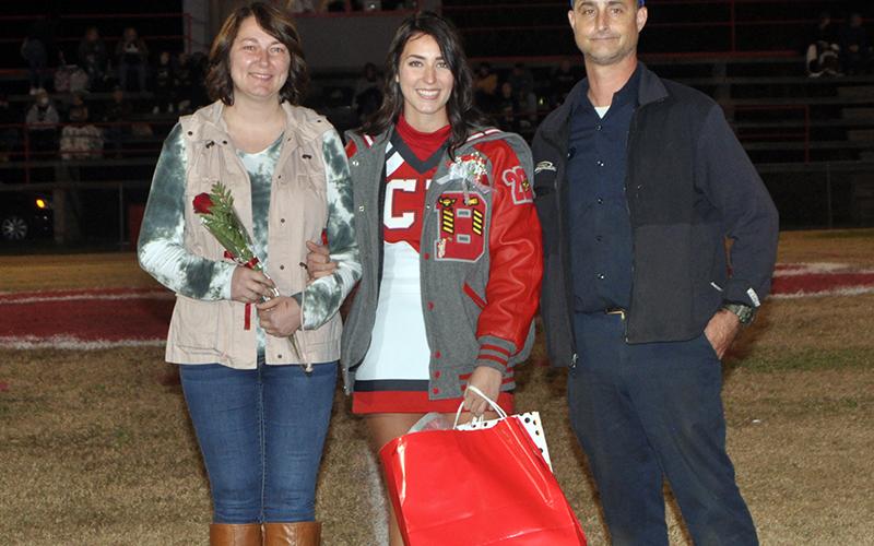 Senior Cheerleader Rebecca O’Neal was honored at Copper Basin’s last home football game Friday, November 6. O’Neal is shown with her parents Craig and Crystal O’Neal.