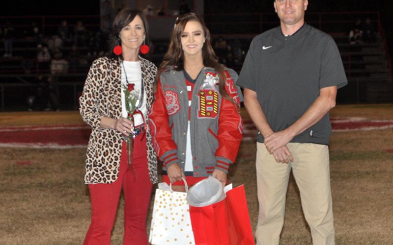 Lady Cougar senior cheerleader Riley Smith was honored during the senior night ceremony at Copper Basin High School Friday, November 6. Smith is shown with her parents, Kevin and Holly Smith.