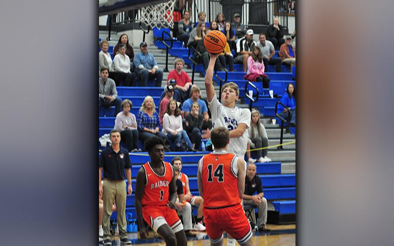Fannin Rebel Landon Norton shoots a floater over a Raider defender during the Rebels’ preseason game against Habersham County Thursday, November 12.