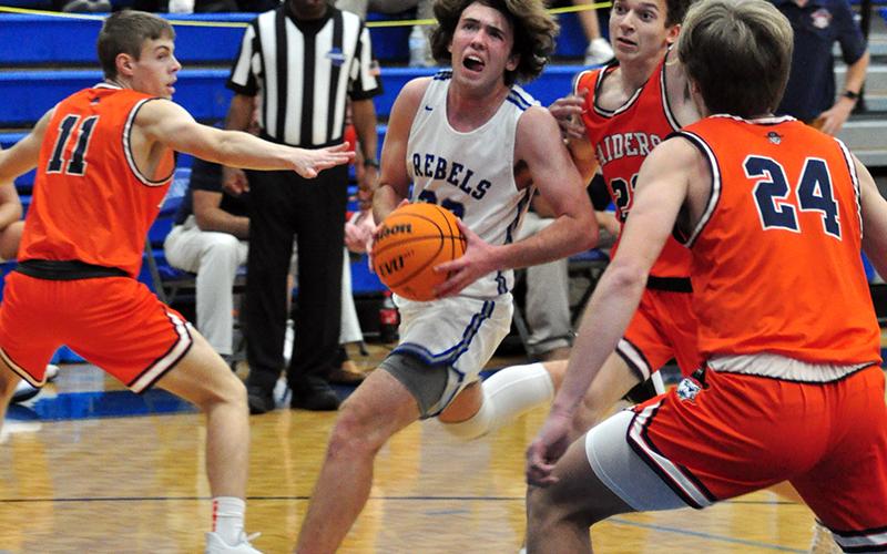 Jordan Bennett fights through contact during the Rebels’ preseason basketball game against the Habersham Raiders Thursday, November 12.