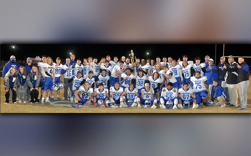 The Fannin County football squad shows off their region championship trophy after their 55-7 win over Dade County Friday, November 20. The title came from the Rebels' perfect 8-0 overall record and 5-0 region mark this season. Please see B1 for complete coverage of the Dade County contest.