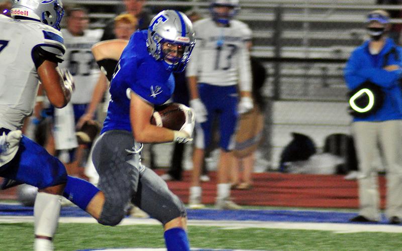 Seth Reece (5) outruns a defender for a big gain in recent action for the Fannin County Rebel football team.