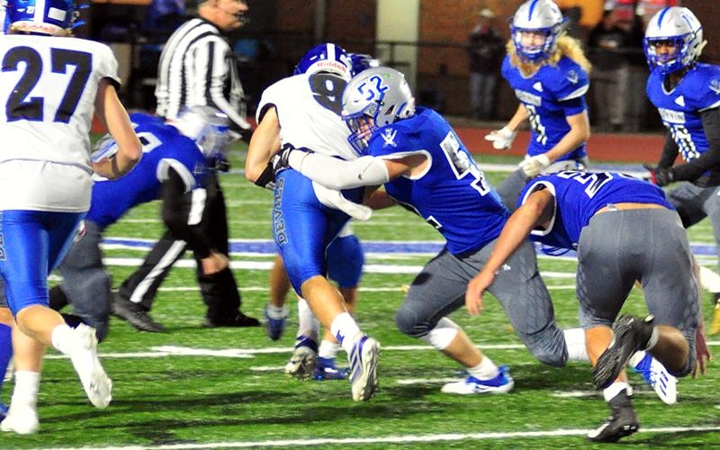Micah O’Neal (52) tackles a Model ball carrier during the Rebels win against the Model Devils Friday, October 30.