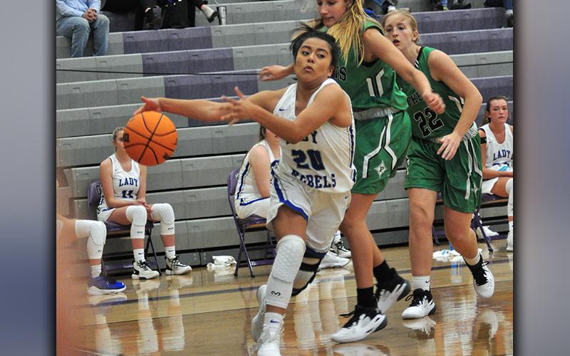 Lady Rebel Prisila Bautista drives past a Pickens defender during the Lady Rebels win against the Dragonettes Saturday, November 21.
