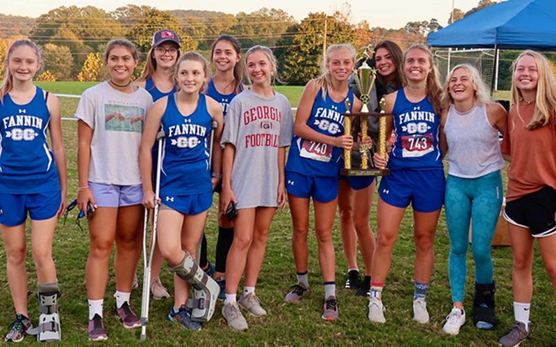 The Fannin County Lady Rebels cross country team won first place in the region at thier region meet Tuesday, October 27. Shown following the region victory are, from left, Erin Jones, Taylor Poland, Olivia Temples, Shaylee Jones, Kristin Cipich, Hannah Sosebee, Carlee Holloway, Monica Cosentino, Kinsley Sullivan, Teagan Cioffi, Annabell Lillard.