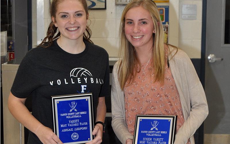 Varsity Lady Rebel Abby Ledford, left, and Junior Varsity Lady Rebel Abigail Vest won the Lady Rebel Most Valuable Player Award at the Lady Rebel volleyball banquet Tuesday, November 10.