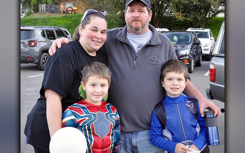 The Carroll family didn’t waste any time going out and getting their share of Halloween Candy during McCaysville and Copperhill’s annual Halloween Safe Zone Saturday, October 31. Shown are, from left, back, Steve and April and, front, Noah and Stephen.
