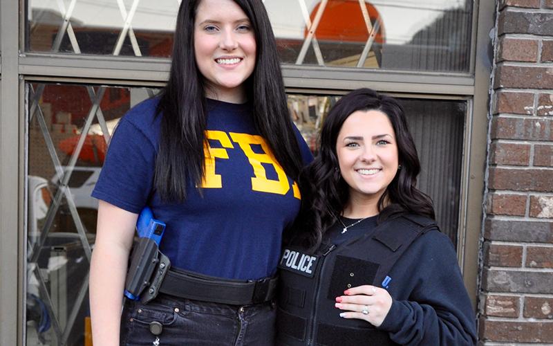 Bailey Mundy, right, and Peyton Rogers kept an eye out for criminals during McCaysville and Copperhill’s annual Halloween Safe Zone.