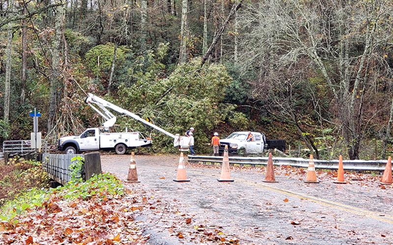 Tri State EMC, along with others, worked to restore power and unblock roads after inclement weather Thursday, October 29. Here, a large tree is shown blocking the road way, causing travelers to either wait or take a detour on Highway 2 in Epworth.