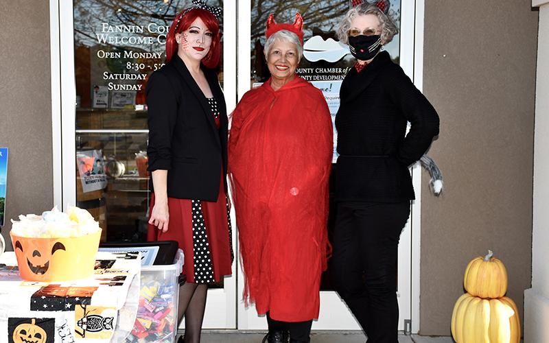 Trick-or-treaters were in for a fun treat when they visited the Fannin County Chamber of Commerce on Halloween. Shown are, from left, Director of Communications &amp; Events Kim Foster, Director of Membership Dianne Mallernee and Guest Services representative Lynn Johnson.