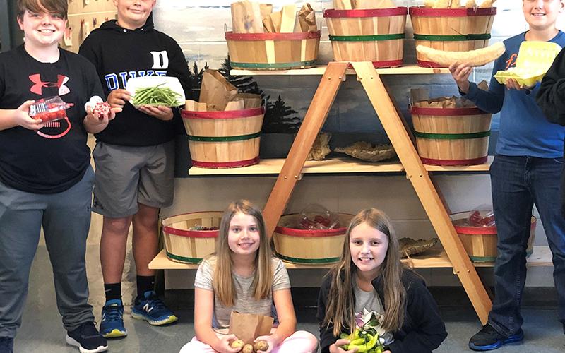 Blue Ridge Elementary School students show off produce for sale at the school’s new Bears Farm and Arts Mini Famer’s Market. Shown are, from left, Drew Dyer, Reed Holloway, Laurel Minear, Adalyn Stanley and Alex Cruse.