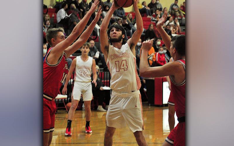 Copper Basin Cougar Logan Burkett puts up a shot during the Cougars game against Polk County Thursday, December 3.