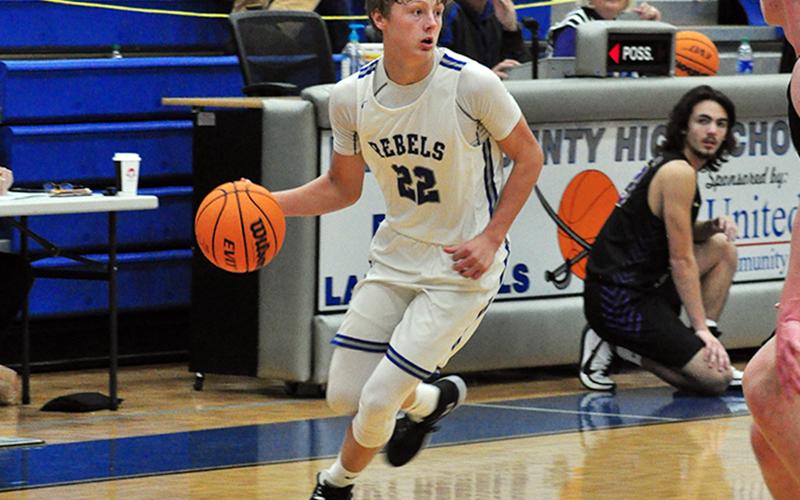 Rebel Landon Norton looks for the open man in a fast break during the Rebels 50-49 win over Union County Saturday, December 12.