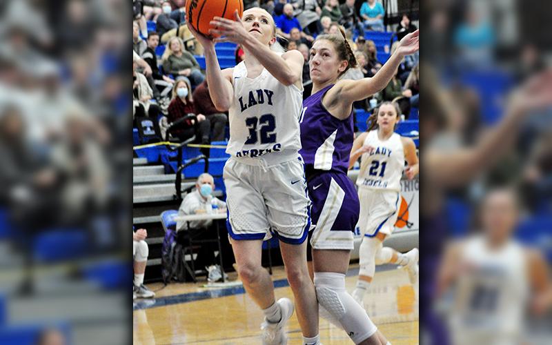 Lady Rebel Mackenzie Johnson goes up for a contested lay-up in recent action for Fannin County.
