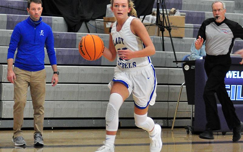 Regan York drives to the basket in recent action for the Lady Rebels basketball team.