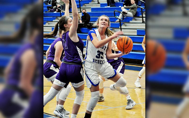 Lady Rebel Reagan York fights through contact for a basket in recent action for the Fannin County Lady Rebels basketball team.