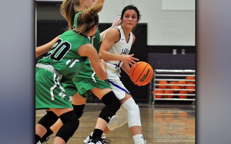 Lady Rebel Becca Ledford fights through a double team in recent action for the Fannin County Lady Rebel basketball team.