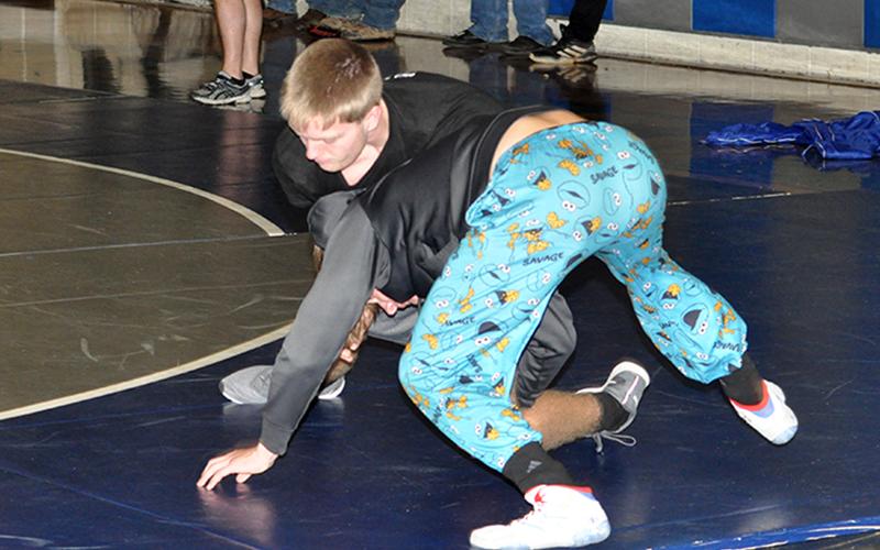 The Rebels’ Carson Collis (top) and Drake Cantrell practice technique at the Fannin County wrestling practice Wednesday, December 16.