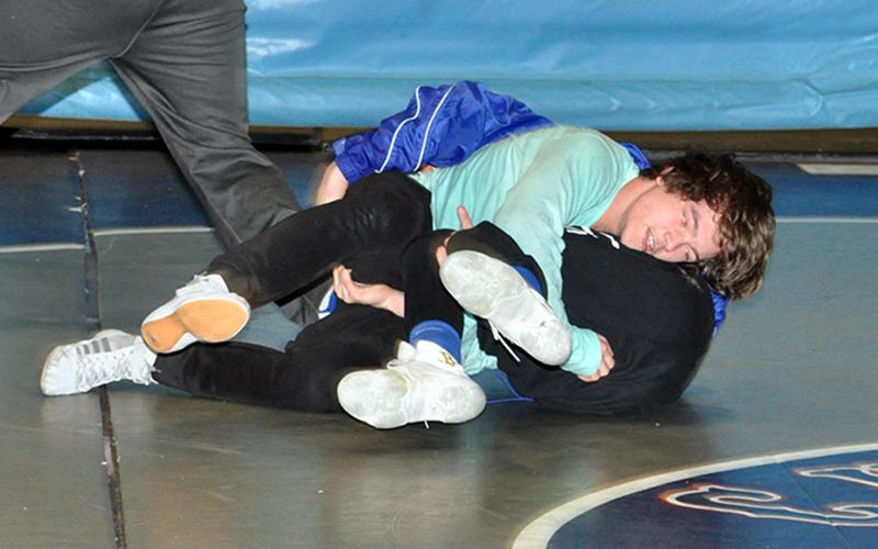 Fannin wrestler Corbin Davenport works to pin his opponent during the Rebels wrestling practice Wednesday, December 16.