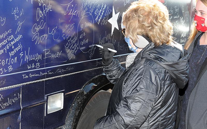 Supporters of Win Georgia, Save America were invited to sign U.S. Senator David Perdue's bus when it stopped in Fannin County.