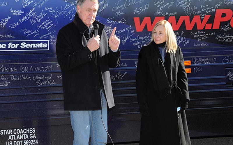 U.S. Senator David Purdue, with his wife, Bonnie, at his side, makes one of several points during his "Win Georgia, Save America" campaign that stopped in Fannin County last week.