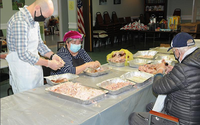 Steve Smith and Starr Webb found themselves busy passing out meals when the Good Samaritans of Fannin County held their annual Open Table Thanksgiving day at the Fannin County Senior Center. This year the event had to be moved from Fannin County High School and changed to a drive-through system. Still, the Good Samaritan volunteers prepared 300 meals for those in need during the holiday.
