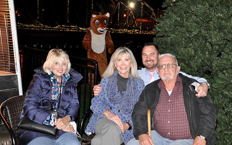 McCaysville City Council Members Gilita Carter and Susan Kiker, McCaysville Police Chief Michael Earley and Mayor Thomas Seabolt, from left, were present to ring in some Christmas cheer during Light Up McCaysville.