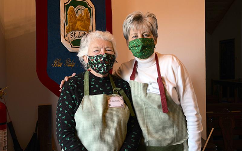 St. Luke’s Christmas Bazaar volunteers Lauren, left, and Theresa greeted attendees as they entered the church to find unique items for sale Saturday, December 5.