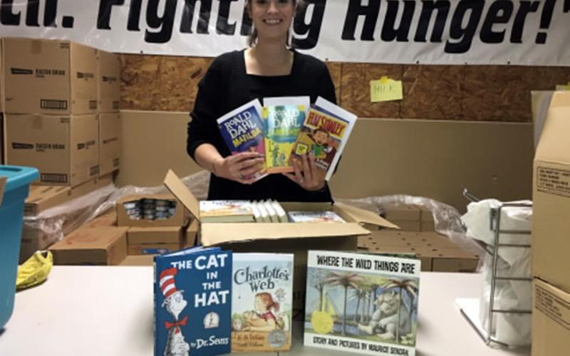West Fannin Elementary School teacher Cayley Hamilton recently partnered with Snack in a Backpack to distribute books to Fannin County children who receive snack packs.