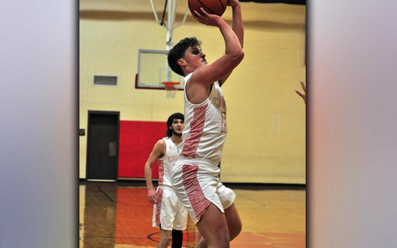 Timothy Jabaley shoots a two-point jumper during the Cougars basketball game against Towns County Monday, January 18.