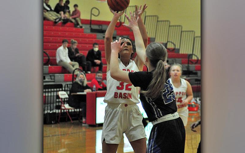 Skyler Nipper shoots a contested jumpshot during the Lady Cougars region win against the CSAS Lady Patriots Tuesday, January 12.